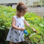 Girl Watering Flowers